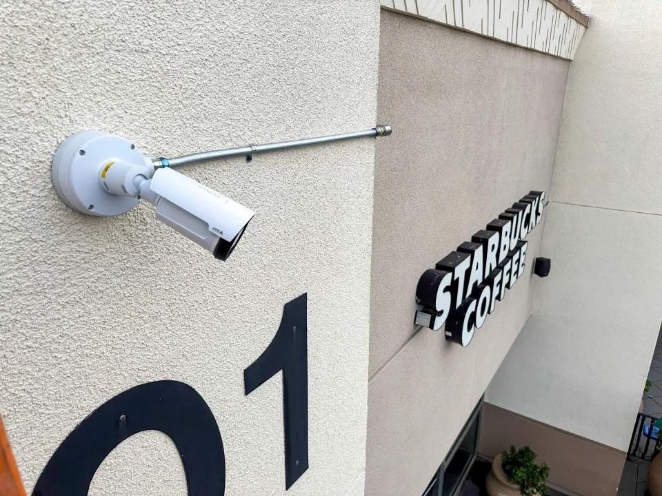 Peninsula Shopping Center Surveillance - Proava Tech Peninsula shopping center surveillance and LPR camera installation by Proava Tech - AXIS IP cameras, multi-building network photo 1
